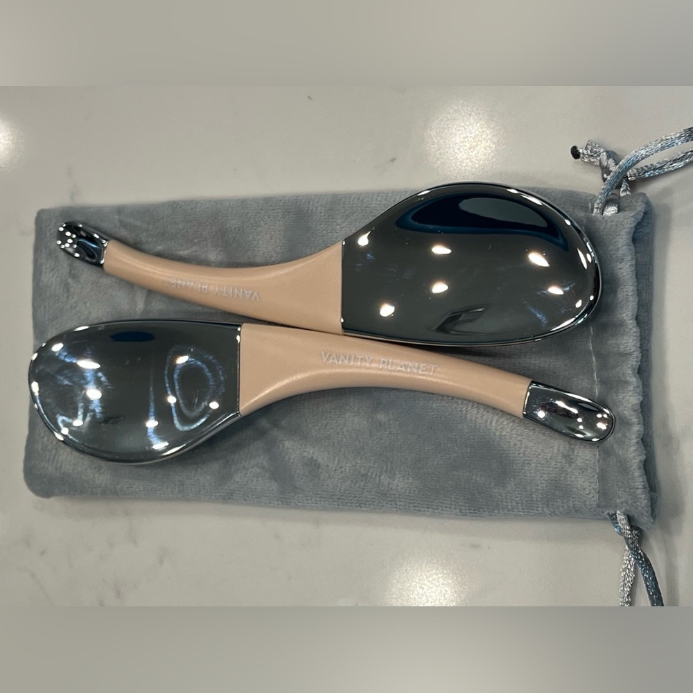 Silver and Cream Colored Skincare Massage Tools